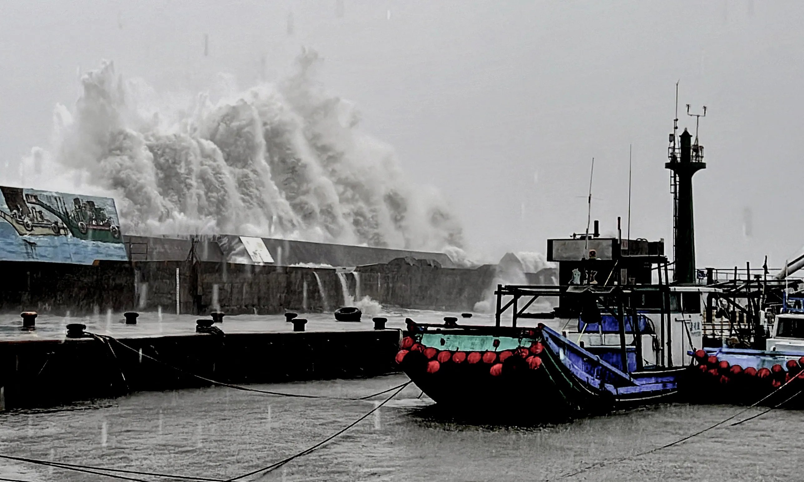 A wave crashing over a sea wall as Super Typhoon Kong-rey neared the coast in Taitung