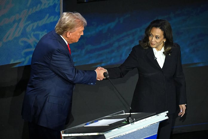 Kamala Harris shakes hands with former US President Donald Trump during a presidential debate in Philadelphia