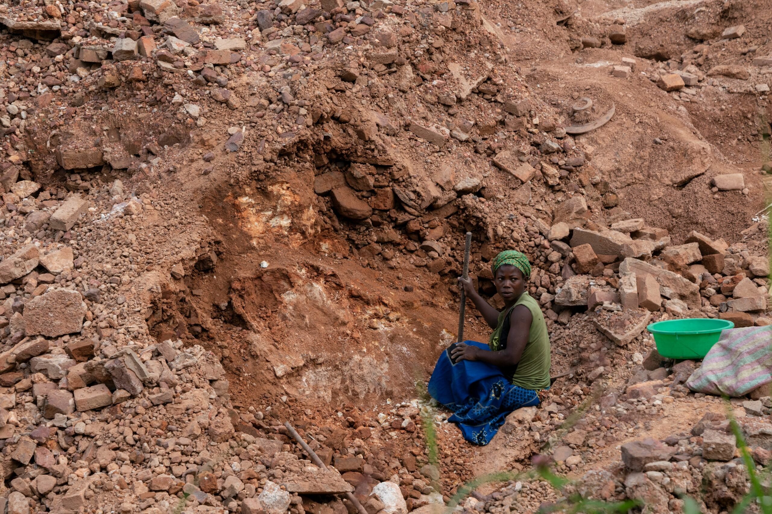 African female lithium mine laborer, Zimbabwe artisanal mining, women in mining industry, Bikita lithium extraction, labor exploitation, lithium supply chain Africa