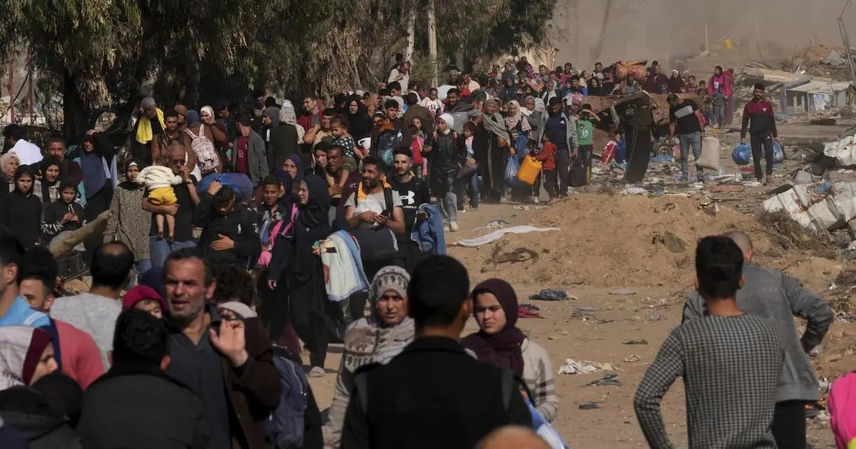 Palestinians running for shelter in Gaza during Israeli airstrikes