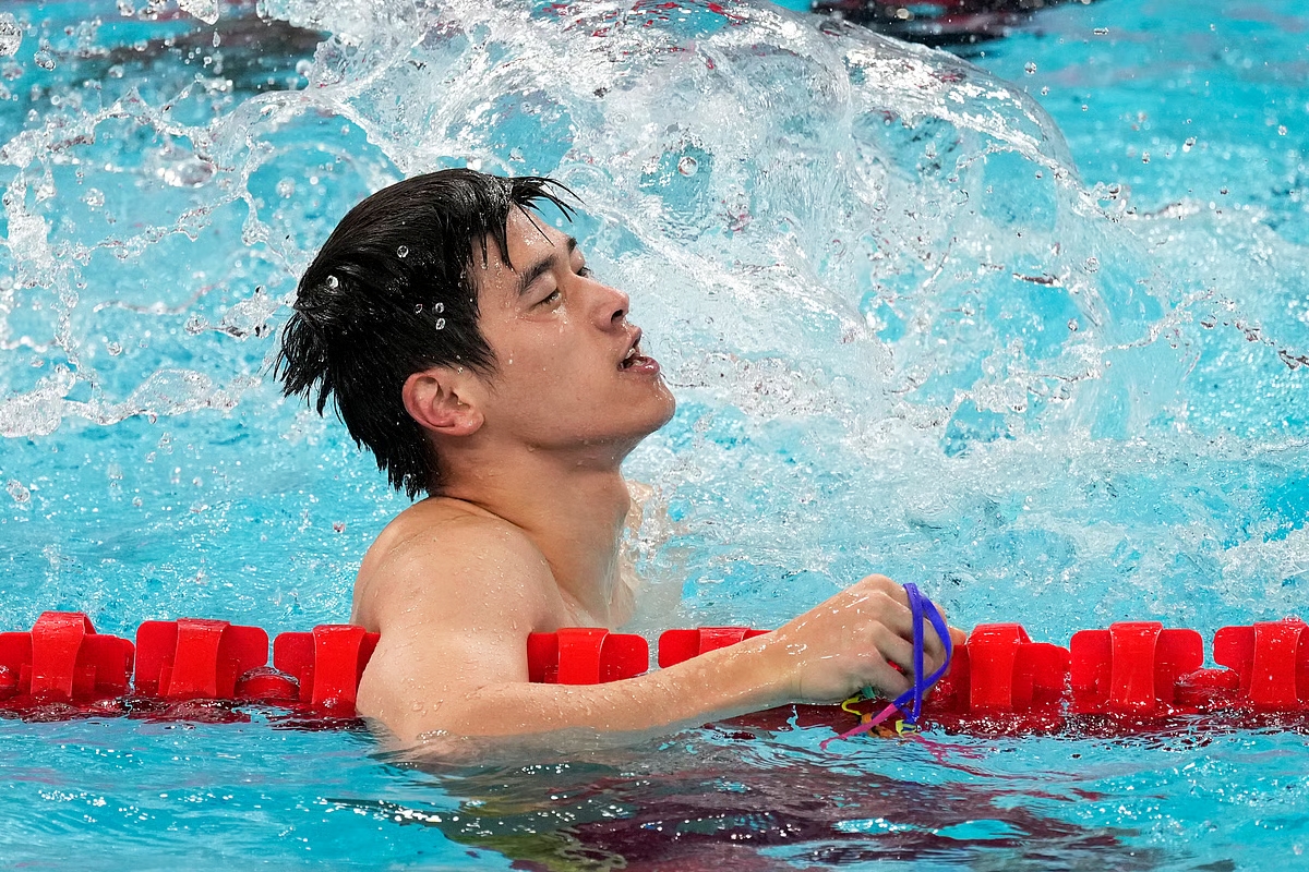 china 2024 olympics swimmer pan zhanle celebrates gold medal and world record in 100m freestyle