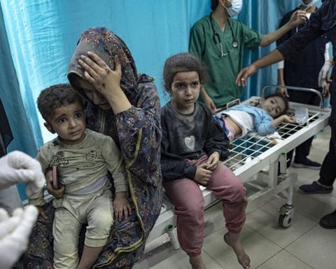 Wounded Palestinian children in Gaza hospital after Israeli airstrikes as US blocks medical visas
