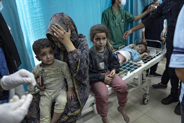 Wounded Palestinian children in Gaza hospital after Israeli airstrikes as US blocks medical visas