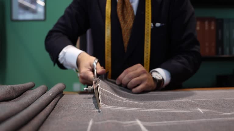 Armani atelier pattern cutting symbolizing the structured sale timeline and governance perimeter