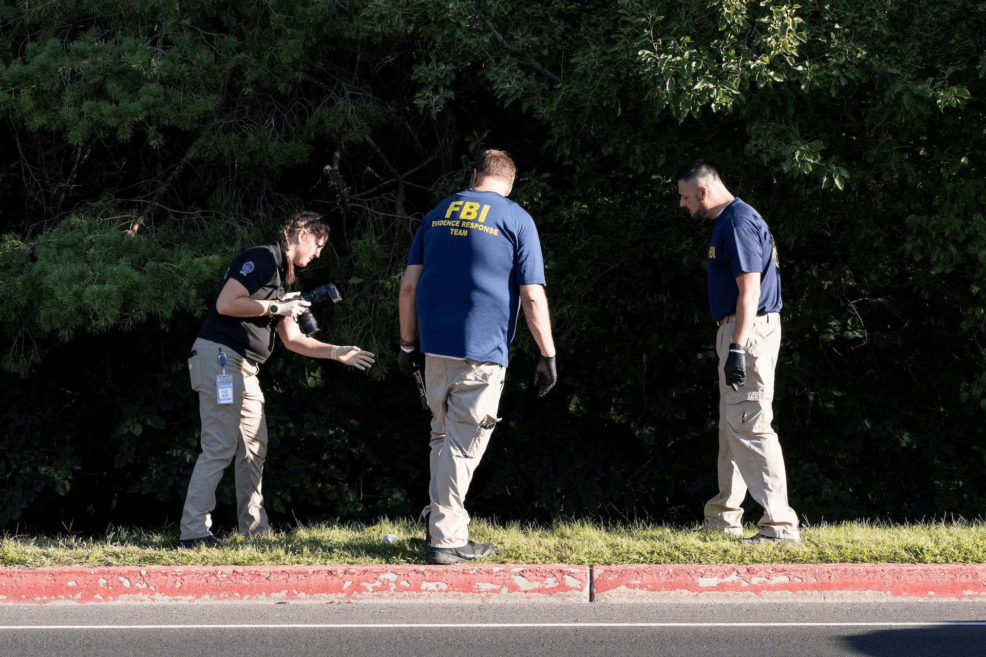 FBI Investigators At UVU Rooftop After Charlie Kirk Shooting FBI and campus police examine a UVU rooftop with cameras and evidence markers after the fatal shooting of Charlie Kirk in Orem, Utah.