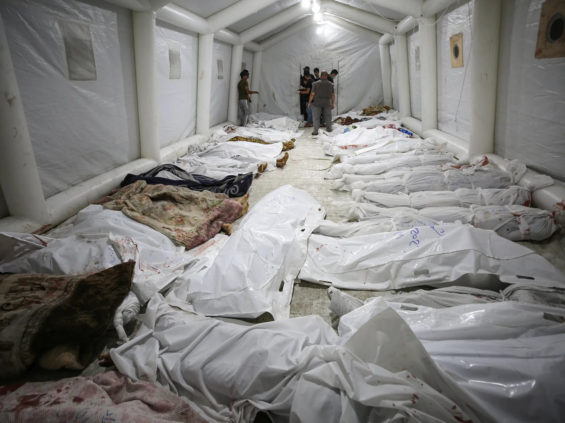 Rubble and chaos at Gaza hospital following strike that killed hundreds, according to Gaza health ministry