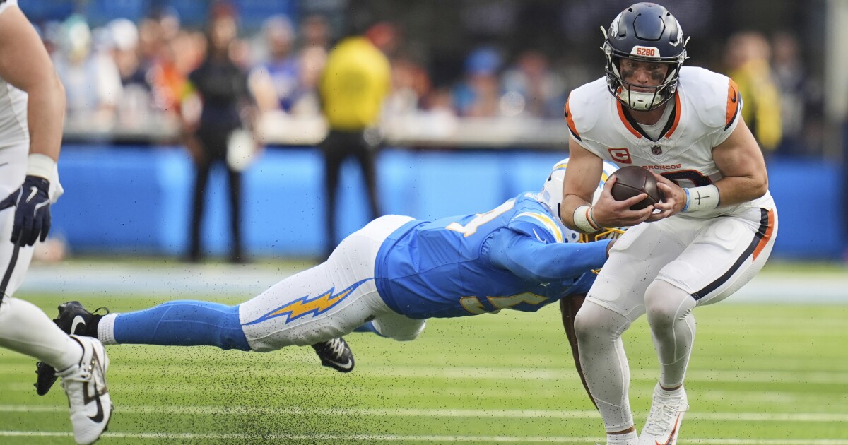 Justin Herbert throws late in the Chargers’ Week 3 win over the Broncos