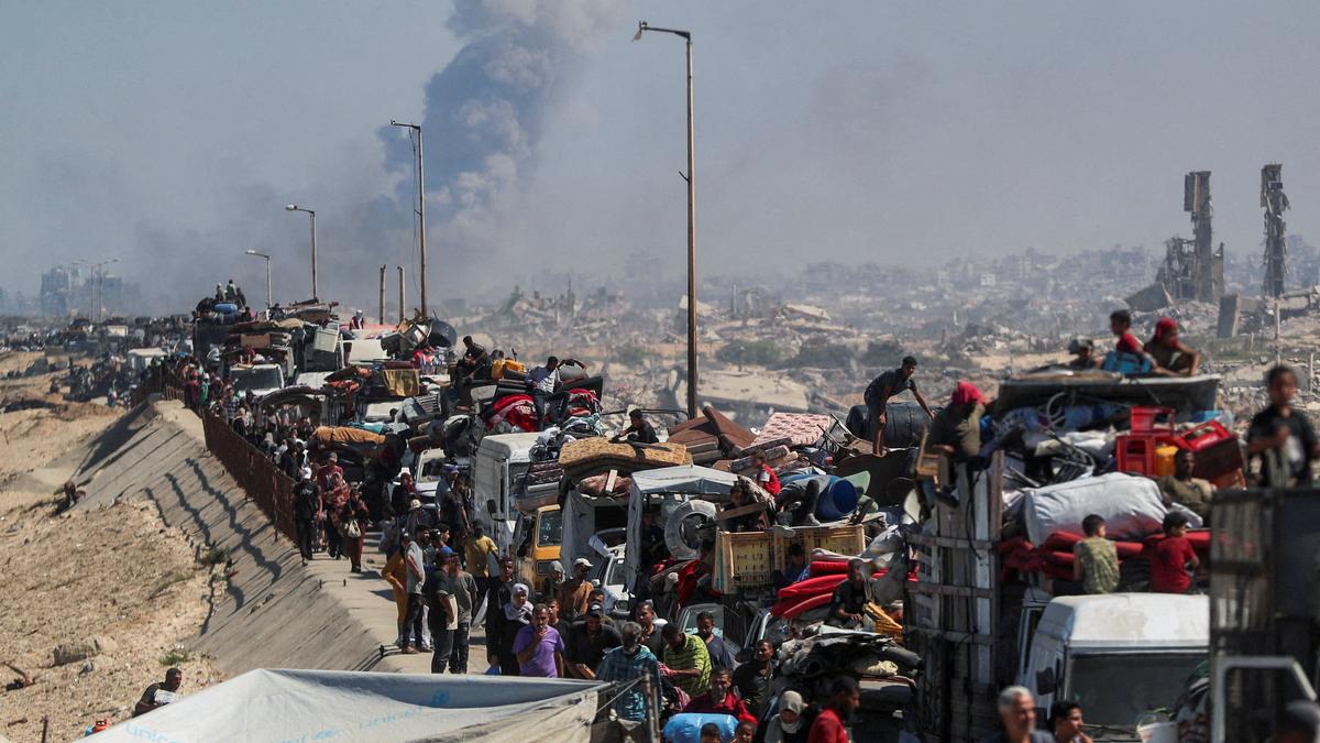 Gaza City under Israeli assault as families flee along the al-Rashid coastal road