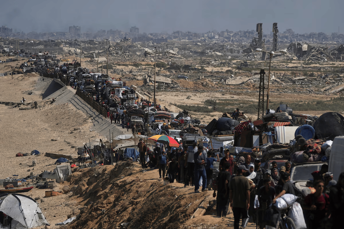 civilians fleeing rubble-strewn streets in gaza city as israeli military advances