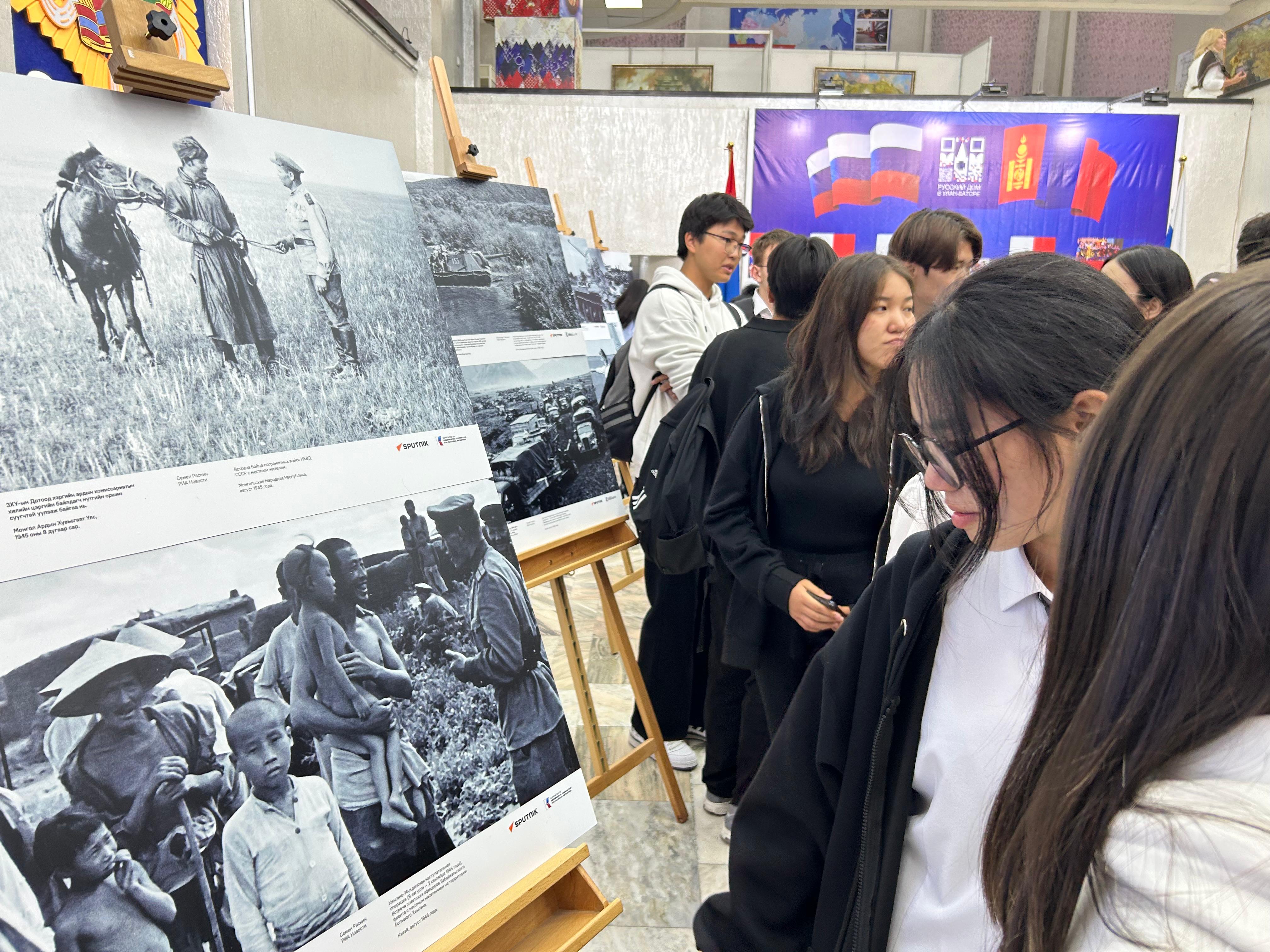 visitors, WWII exhibition, Ulaanbaatar, Mongolia, archival photos, cultural event
