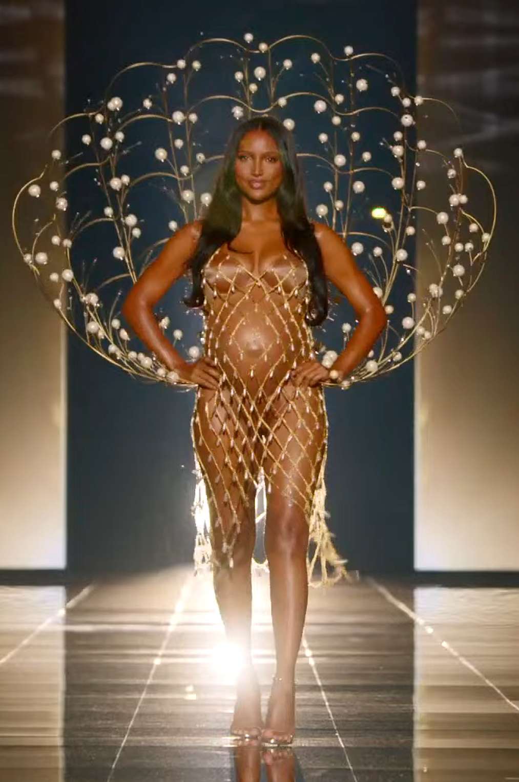 Jasmine Tookes, visibly pregnant, opening the 2025 Victoria’s Secret runway in a sparkling sheer look