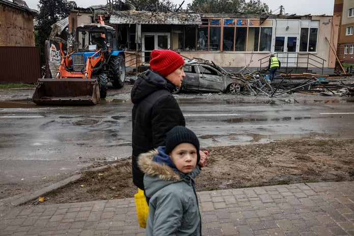 Kyiv neighborhoods in blackout as crews respond to fires after mass strikes