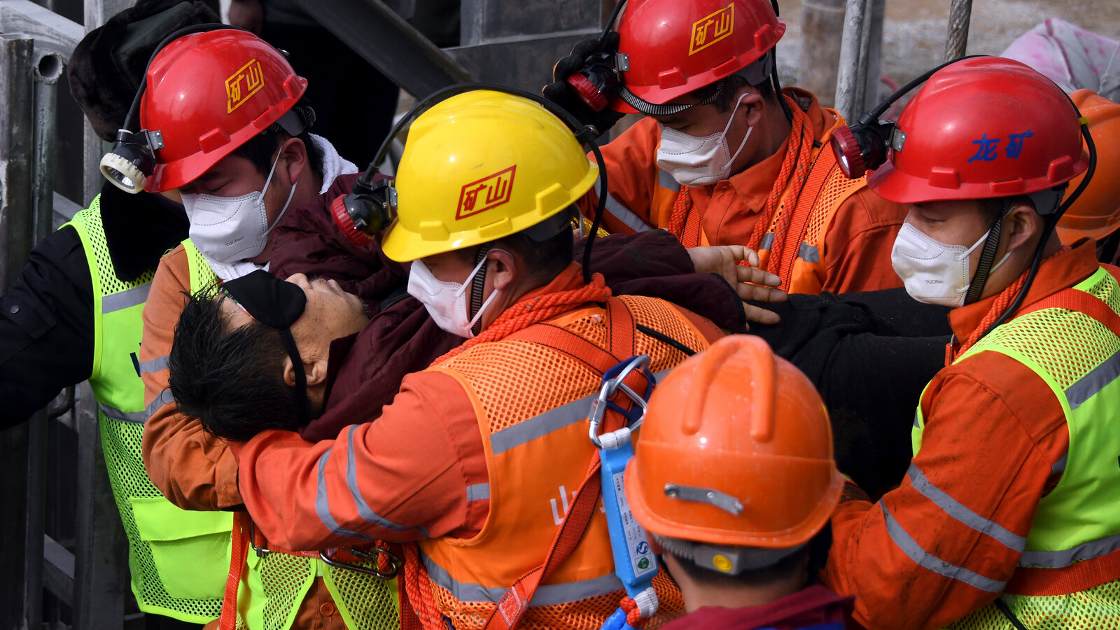Rescued coal miners in Dnipropetrovsk region emerge from a shaft after power loss underground