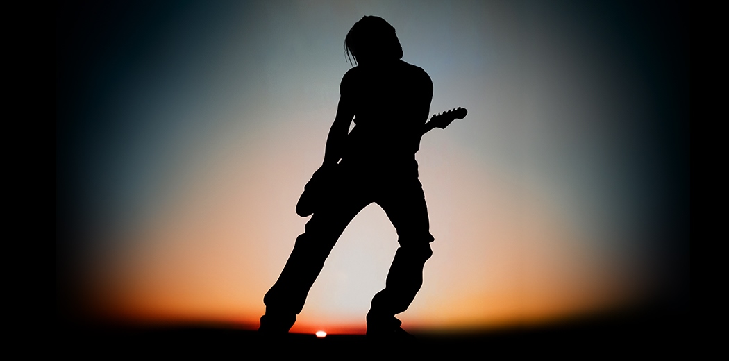 Keith Urban High and Alive World Tour poster silhouette against a sunset