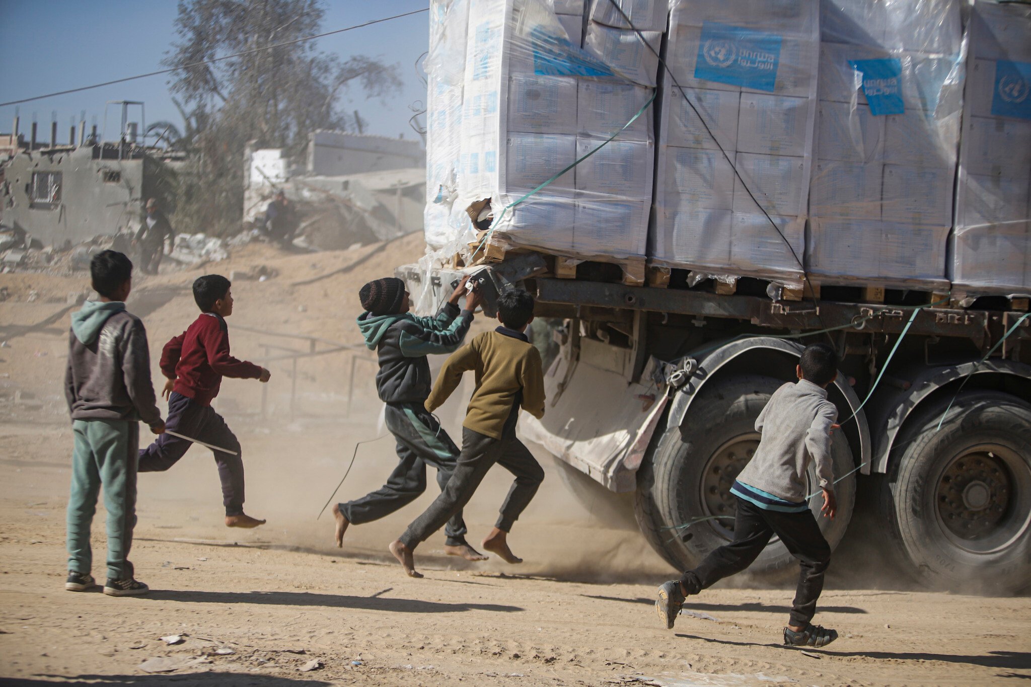 Aid trucks queue at the Kerem Shalom crossing as agencies push to raise daily entries during the ceasefire