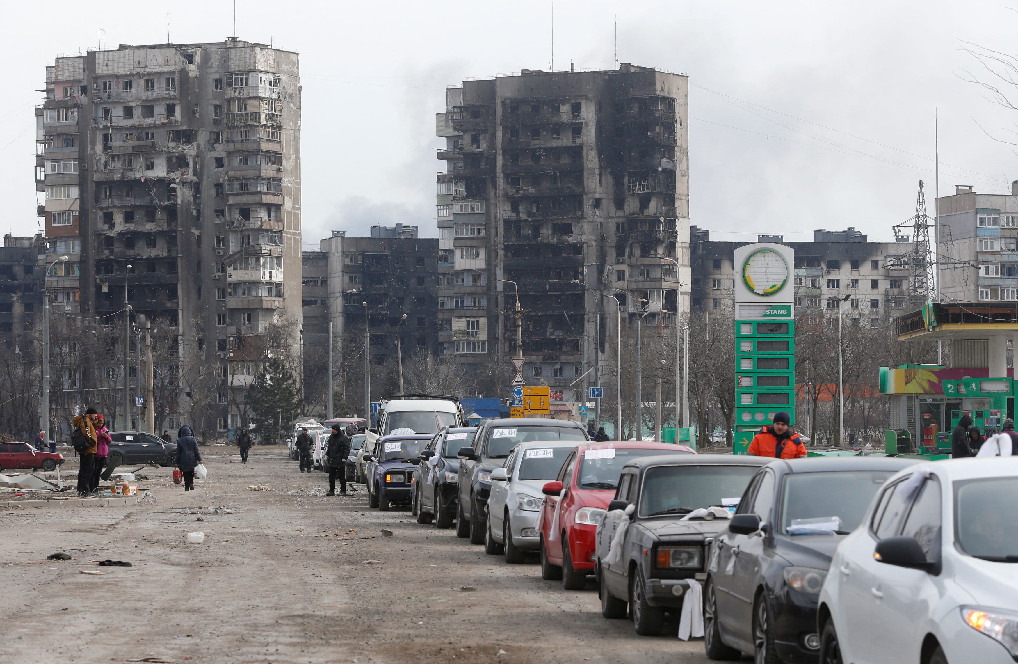Kyiv traffic moving through dark streets during scheduled power cuts after renewed strikes