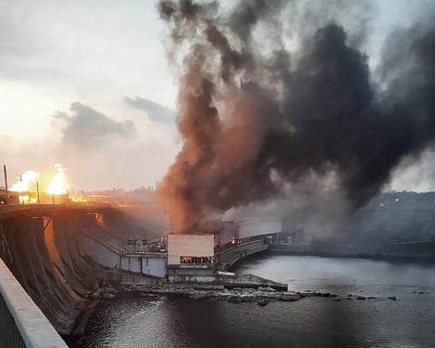 Smoke over Kyiv after an overnight drone and missile barrage that triggered rolling blackouts