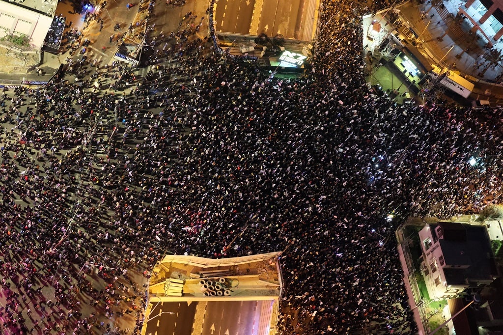 Drone view of Hostage Square protest in Tel Aviv with families holding signs