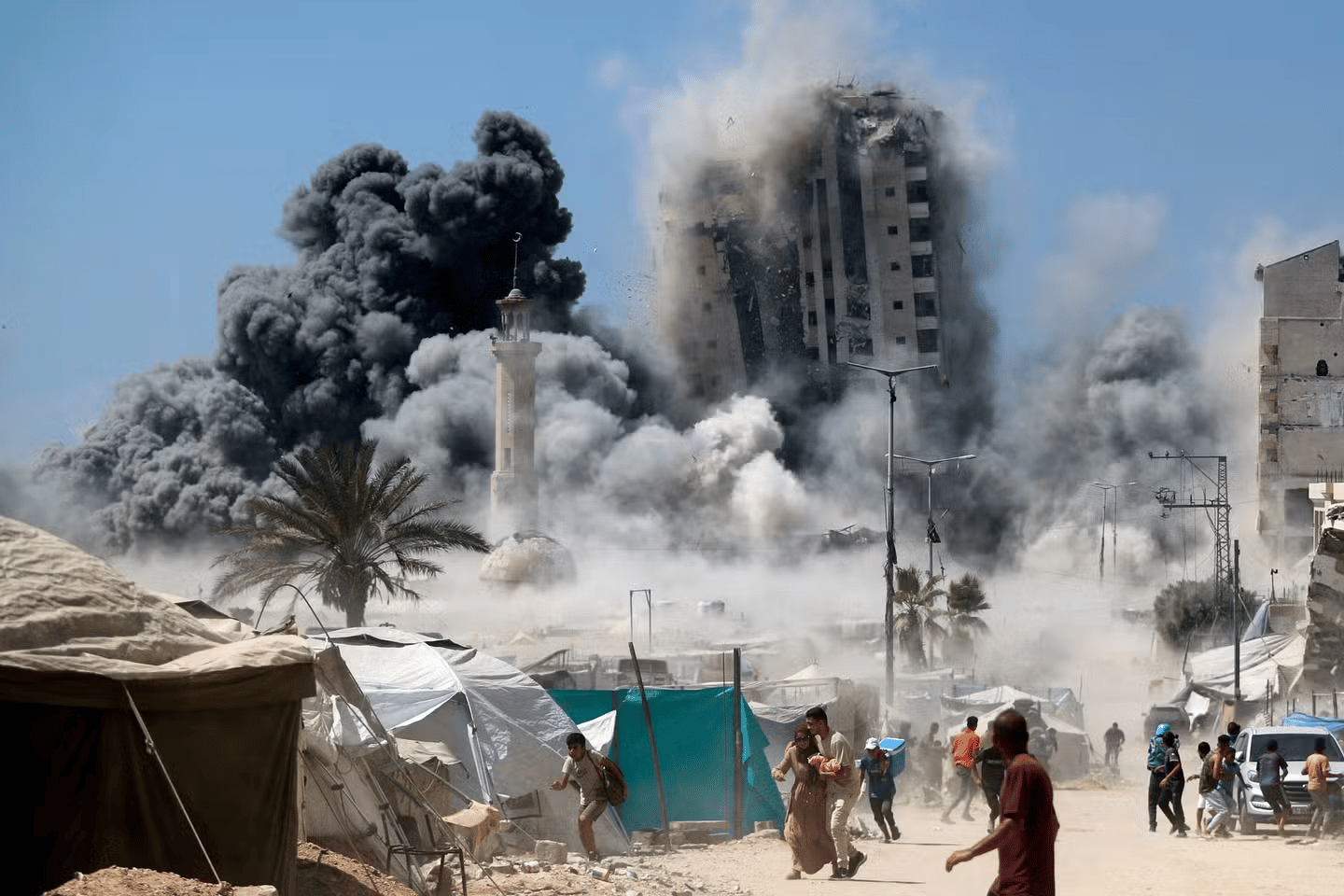 Aerial view of Gaza city with smoke and damaged buildings amid Israel-Palestine conflict, 2025