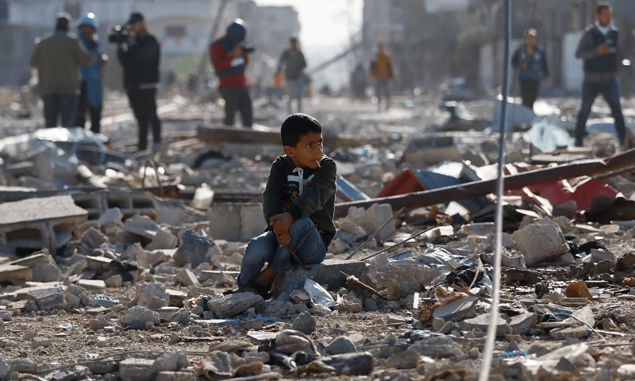 Devastated Gaza neighborhood with displaced Sudanese civilians