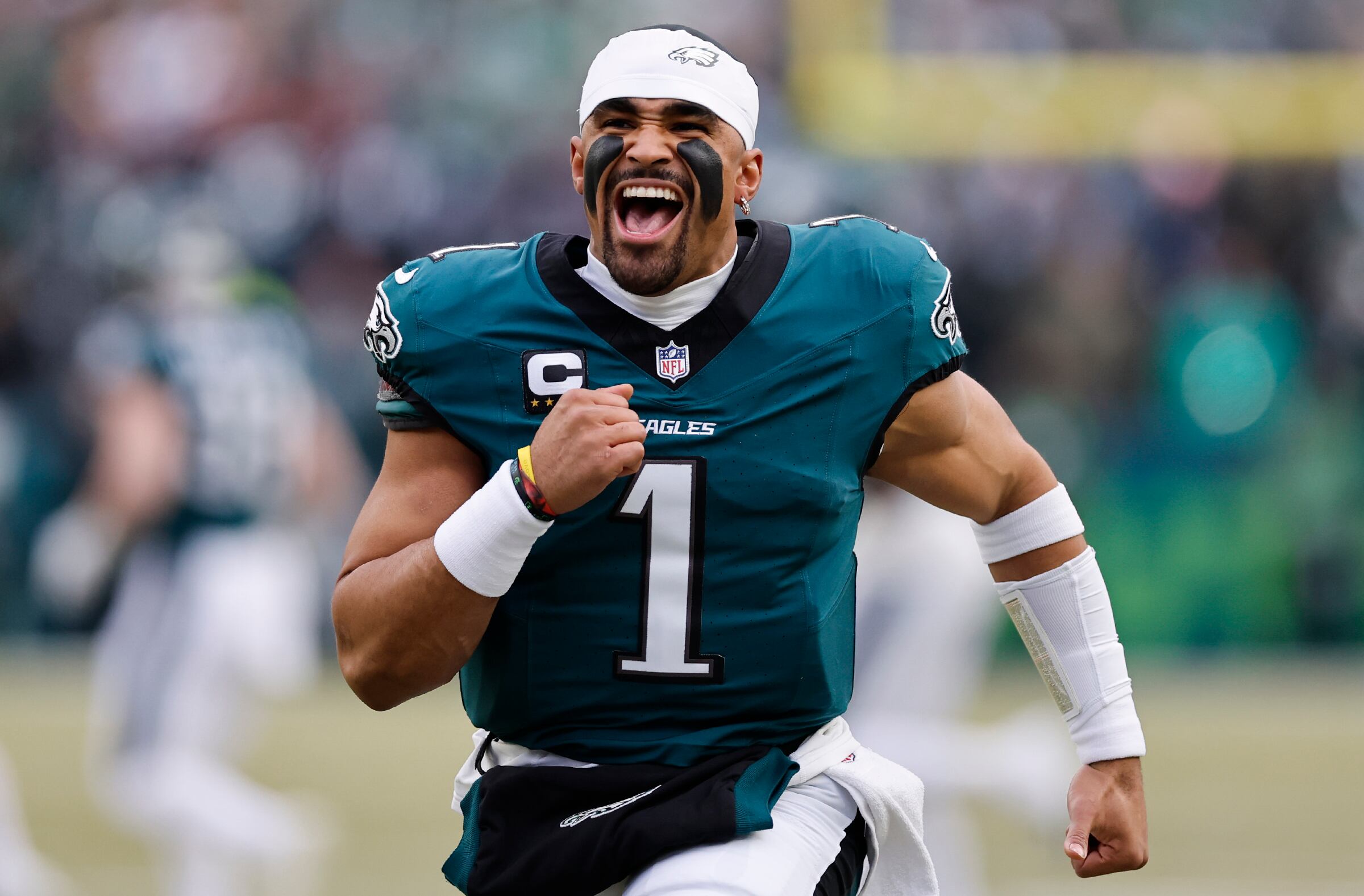 Jalen Hurts Philadelphia Eagles quarterback celebrating with captain's patch during elite performance showcasing MVP candidacy