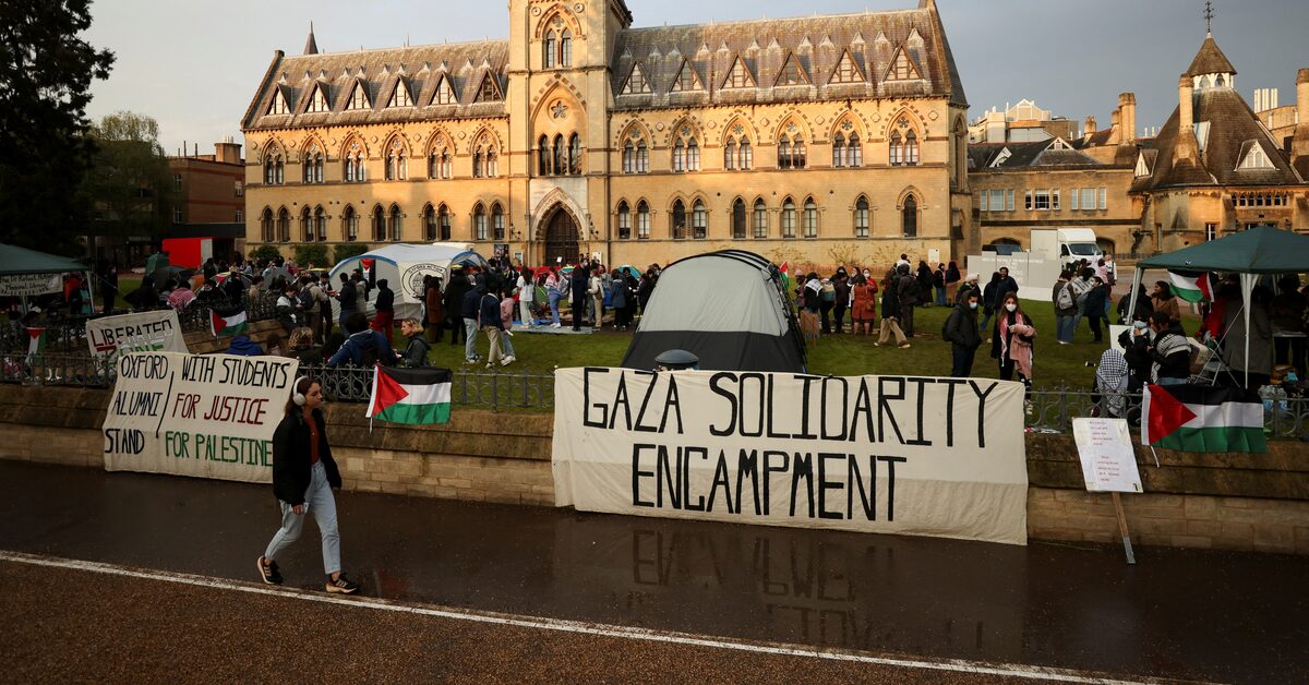Palestinian university students protesting for family visa rights outside UK parliament in 2025