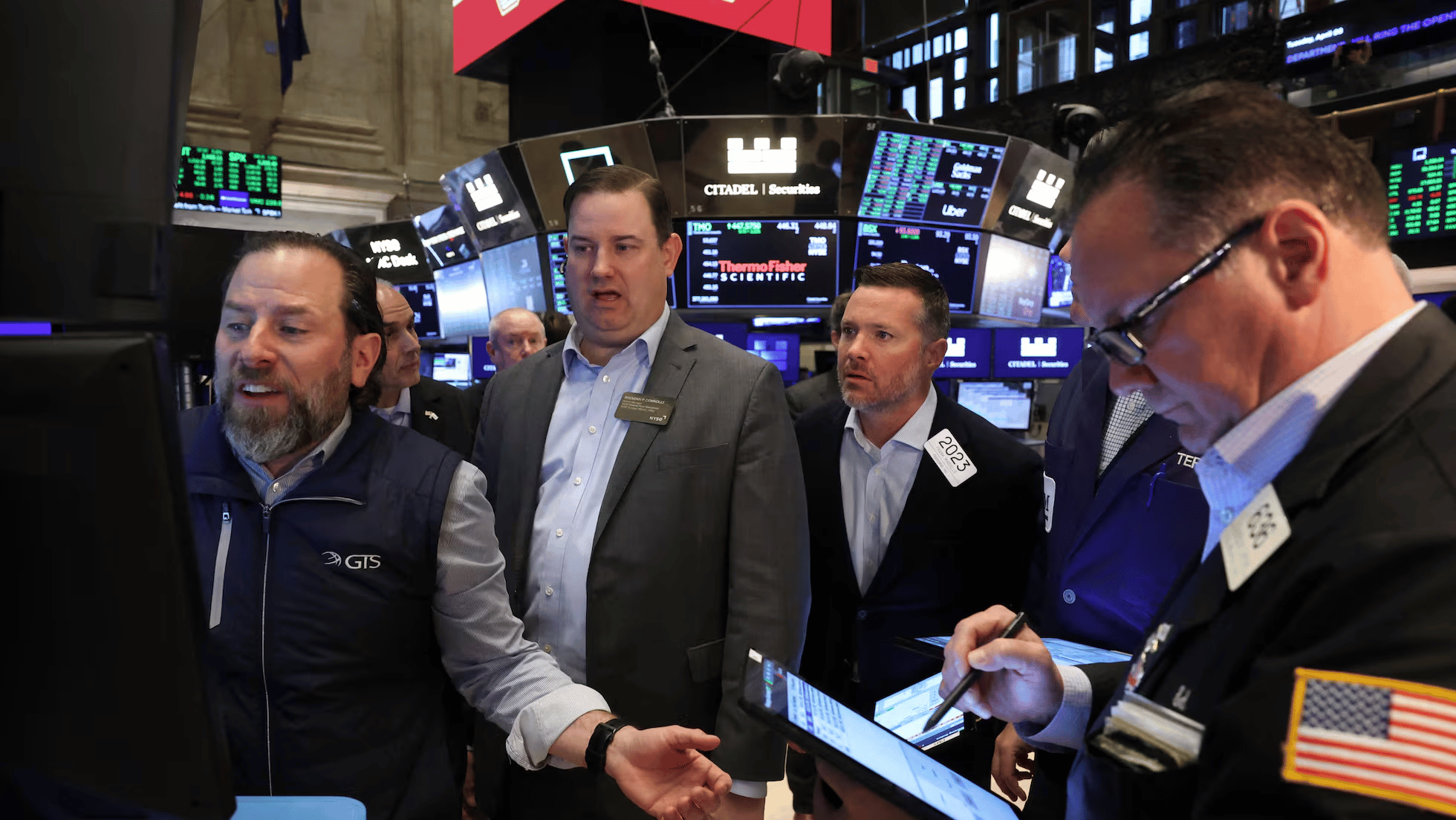 Wall Street traders at New York Stock Exchange during volatile market session
