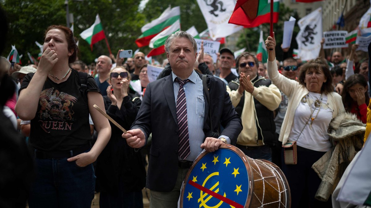 Bulgarian protesters with EU flags rally in Sofia's government district over corruption allegations