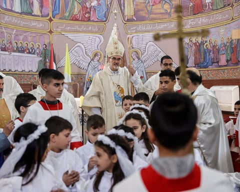 Palestinian Christians pray at Holy Family Church in Gaza amid rubble on Christmas Day 2025 during day 750 of Israeli genocide