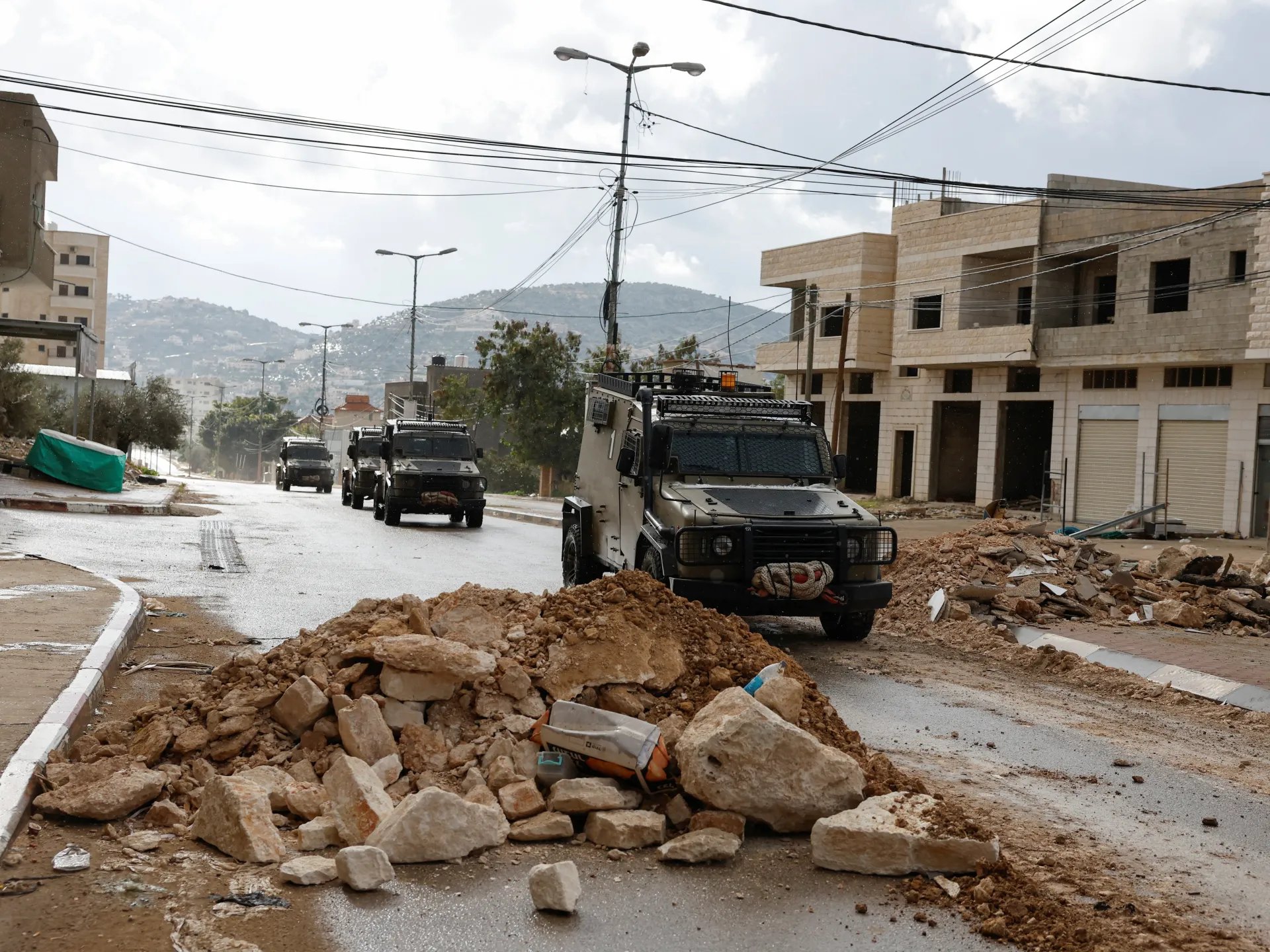 Israeli soldiers occupy Palestinian homes Qabatiya West Bank curfew Gaza genocide