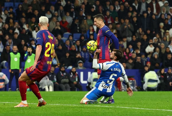 "Robert Lewandowski seals Barcelona's 2-0 victory with 90th-minute goal against Espanyol in Catalan derby"