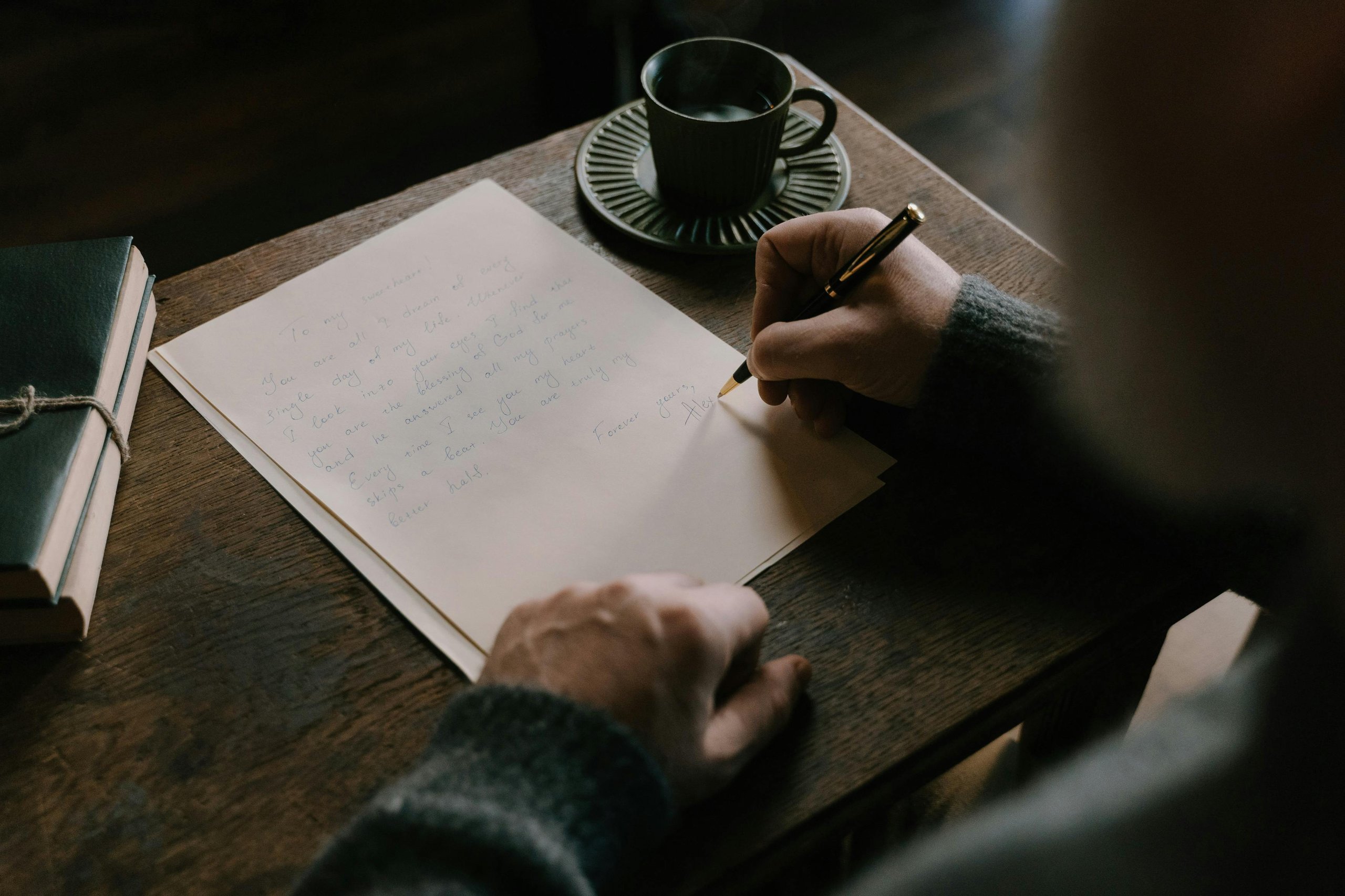A writer sits at a quiet desk practicing mindfulness to improve focus and overcome creative anxiety while writing