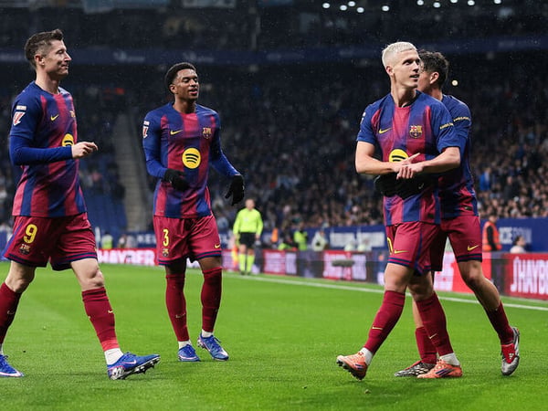 "Dani Olmo celebrates his 86th-minute winner for Barcelona against Espanyol in the Catalan derby"
