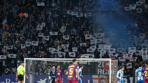 "Hostile Espanyol fans display rat imagery and protest banners targeting Joan Garcia during Barcelona derby at RCDE Stadium"