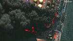 Ukrainian drone strike hits Russia Ust-Luga oil port with smoke rising from storage tanks