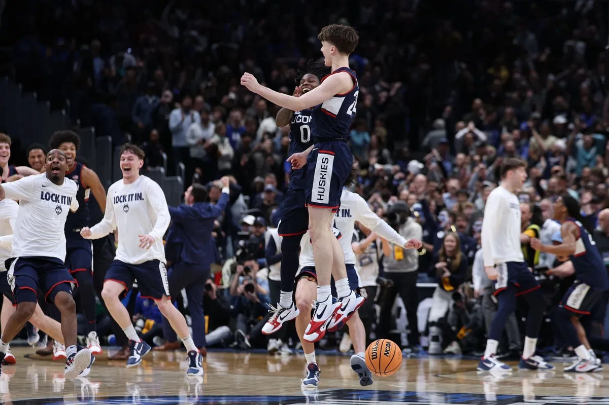 UConn 73, Duke 72 final score on the scoreboard at Capital One Arena during the 2026 NCAA Tournament Elite Eight