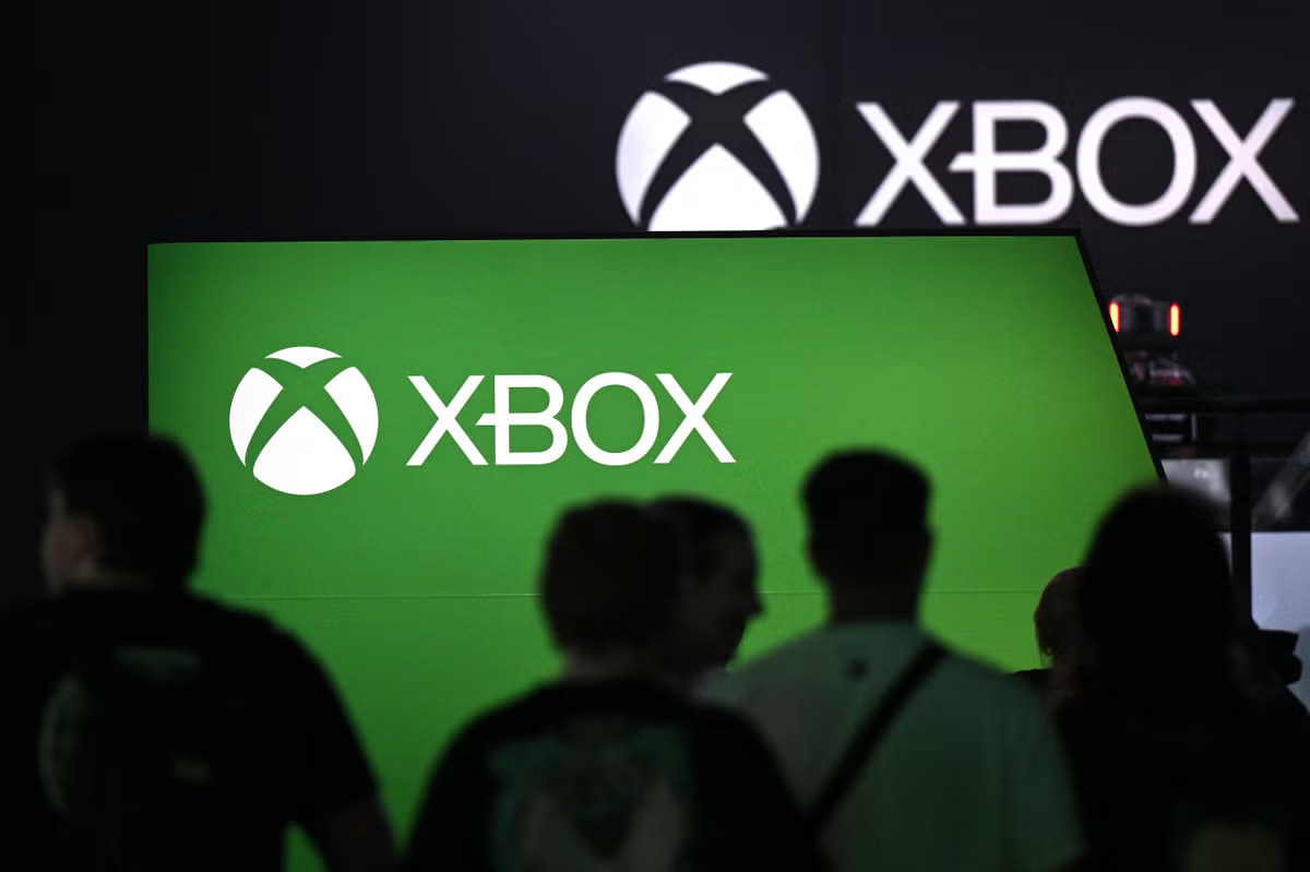 Microsoft executives presenting Xbox Game Pass pricing strategy