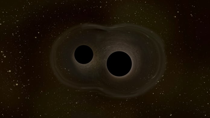 Two massive black holes merging in space, producing spacetime ripples and gravitational waves