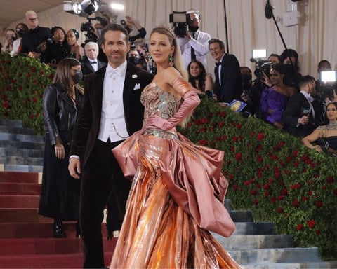 Blake Lively arrives at the 2026 Met Gala in a pastel archival Versace gown with a 13-foot train