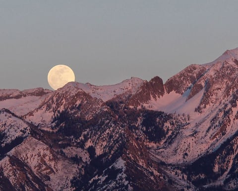 Flower Moon rising on May 1, 2026 over spring landscape with Scorpio constellation in night sky