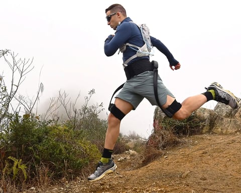Hiker using the Hypershell X Ultra AI-powered exoskeleton on a mountain trail