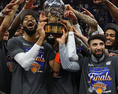 New York Knicks players celebrating on court after sweeping Cavaliers to reach NBA Finals 2026