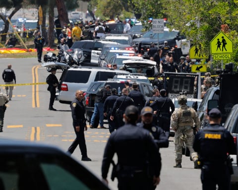 Police and emergency crews secure the Islamic Center of San Diego after two terrorists invoking a Christian crusade killed three in Clairemont