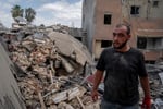 A man walks through the rubble caused by an Israeli air attack in Tyre, Lebanon, May 26, 2026