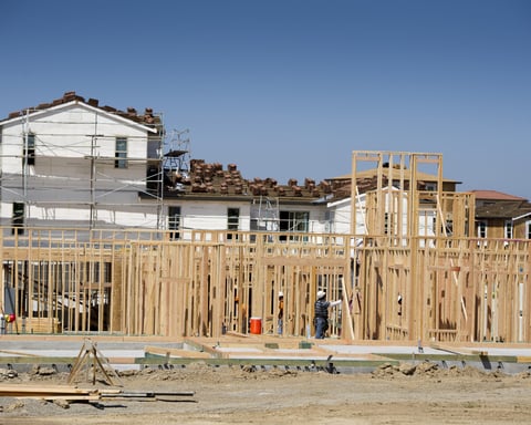 Contractors build a new home at Taylor Morrison La Solara community in Dublin California