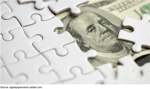 White puzzle pieces obscuring a US hundred dollar bill symbolizing shell company opacity and money laundering risks