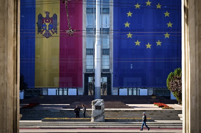 Large flags of Moldova and the European Union on government buildings in Chisinau, September 2025