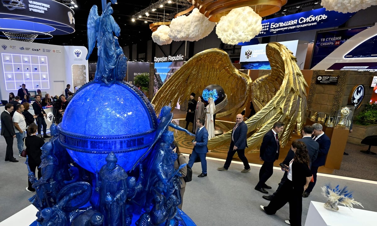 Participants tour the exhibition hall at SPIEF 2026 in St. Petersburg Russia
