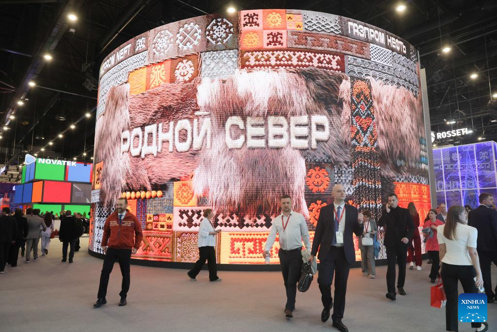 Delegates visit the exhibition hall at the 29th St. Petersburg International Economic Forum, June 2026