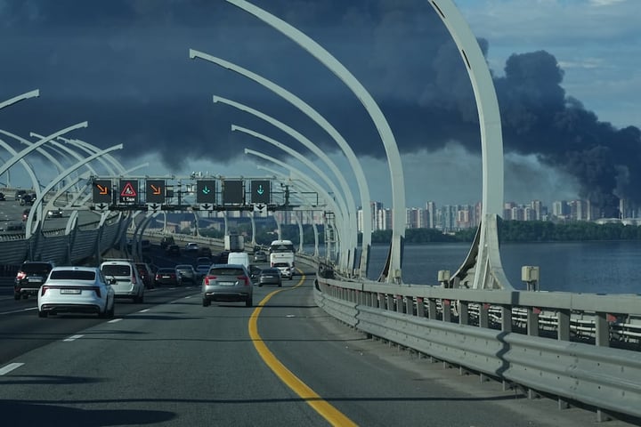 Black smoke rises over the port of St. Petersburg as the SPIEF 2026 economic forum opens